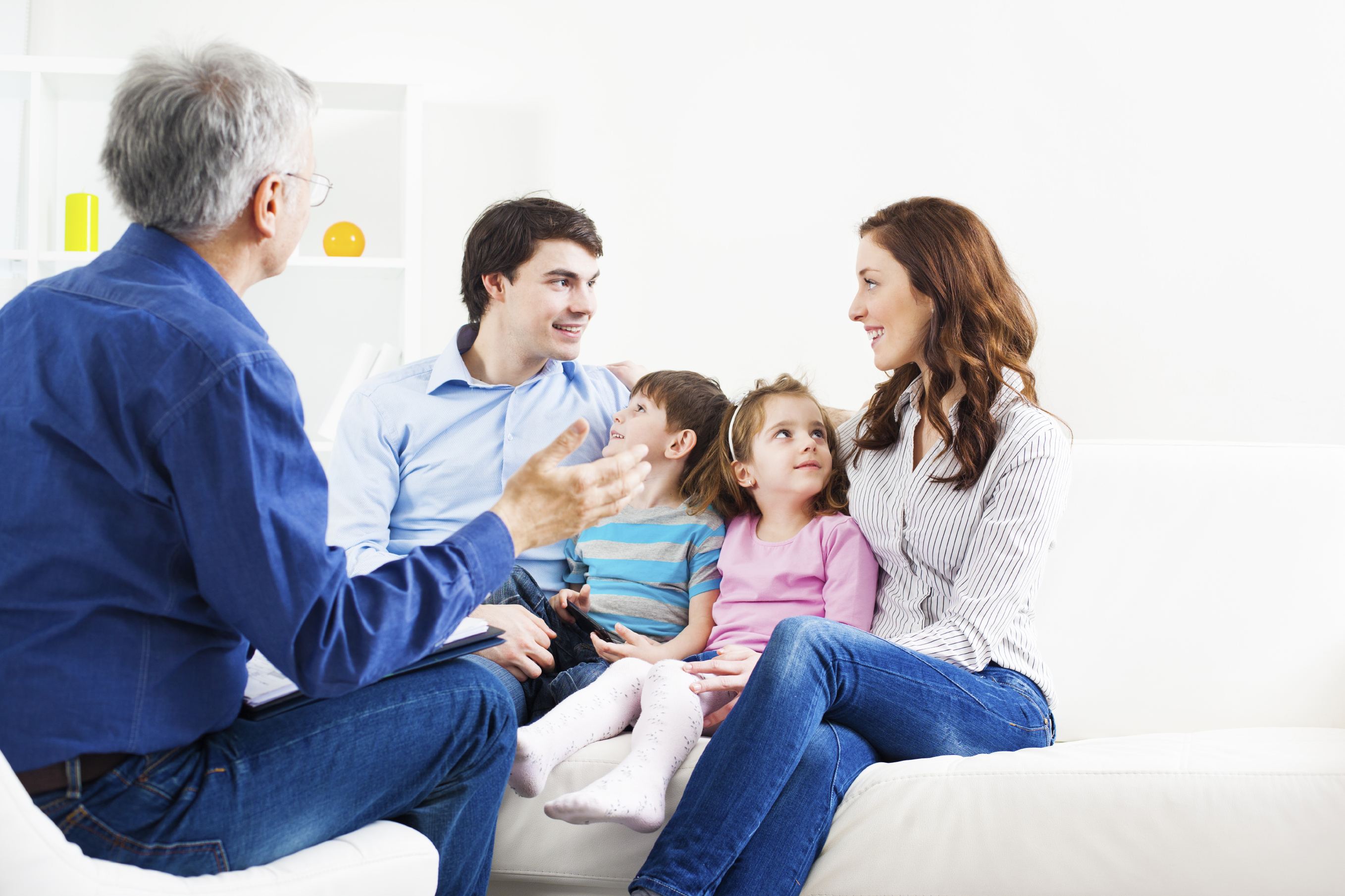 caucasian family talking with counselor